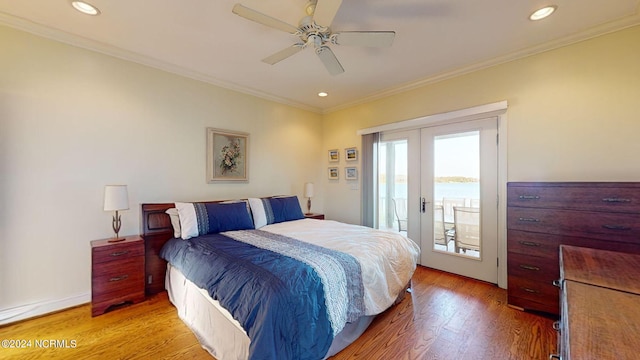 bedroom featuring french doors, recessed lighting, light wood-style flooring, ornamental molding, and access to outside