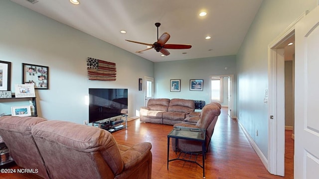 living room with ceiling fan and hardwood / wood-style flooring