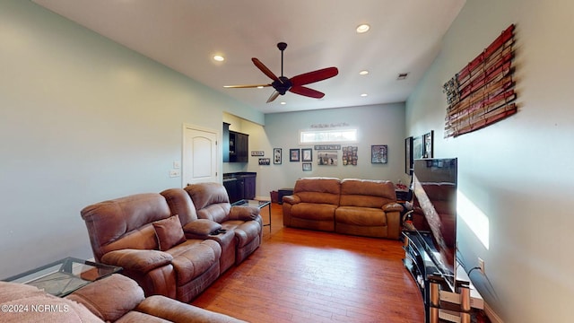 living area featuring recessed lighting, wood-type flooring, ceiling fan, and baseboards