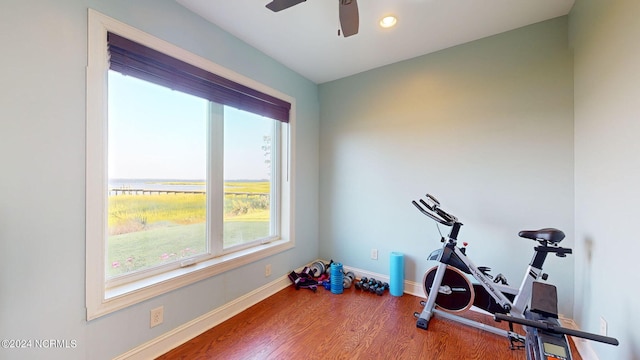 workout area with recessed lighting, ceiling fan, baseboards, and wood finished floors