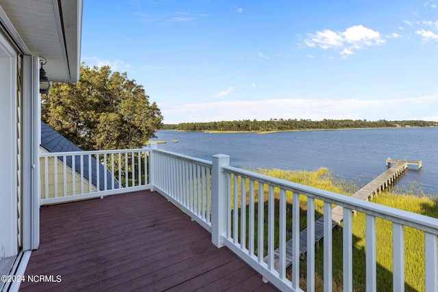 wooden terrace featuring a water view