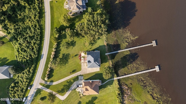 birds eye view of property with a water view