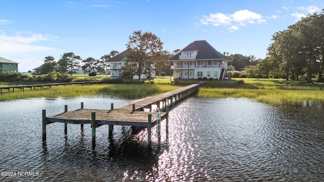 dock area featuring a water view