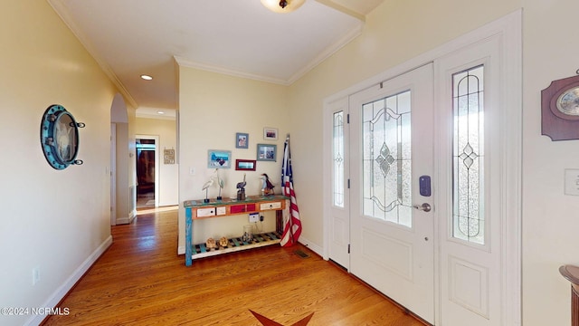 foyer featuring recessed lighting, crown molding, light wood-style flooring, and baseboards