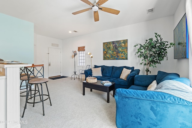 living room featuring ceiling fan and carpet floors