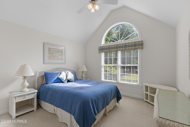 bedroom with light colored carpet, ceiling fan, and vaulted ceiling