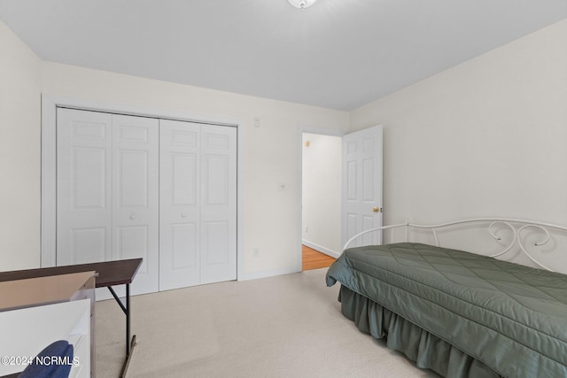 carpeted bedroom featuring a closet