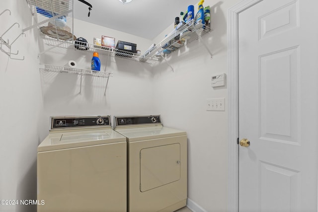 laundry room featuring separate washer and dryer