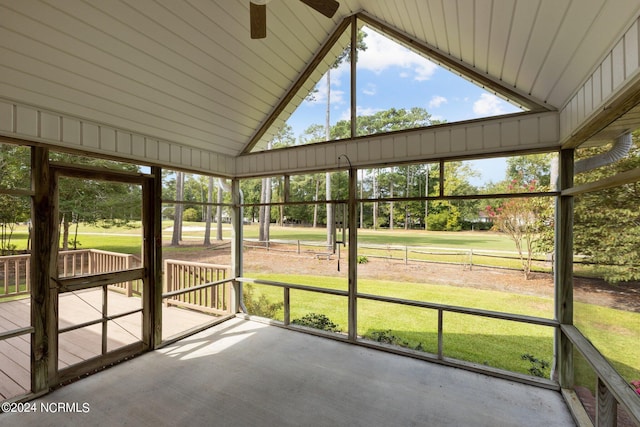 unfurnished sunroom featuring lofted ceiling and ceiling fan