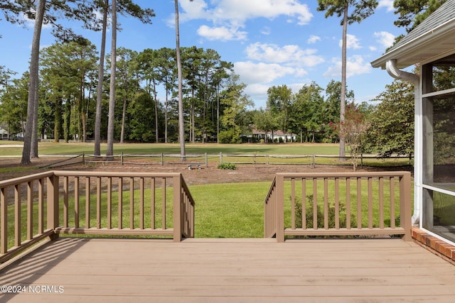 wooden terrace with a yard