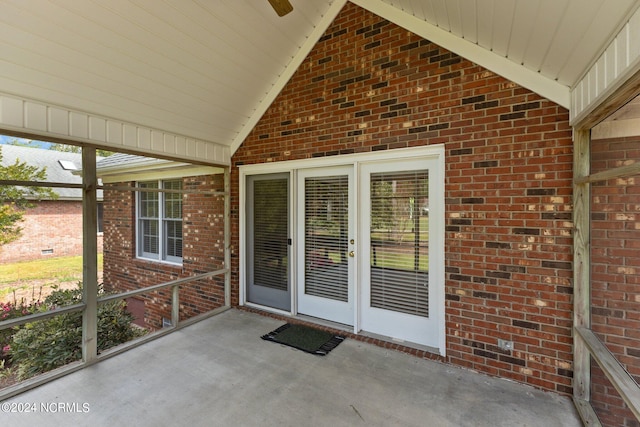 unfurnished sunroom featuring lofted ceiling