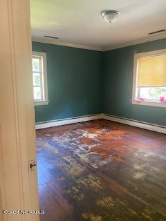 spare room featuring dark hardwood / wood-style flooring