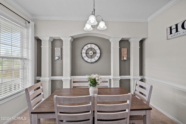 carpeted dining space featuring a notable chandelier, a healthy amount of sunlight, and ornamental molding