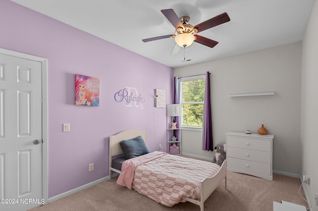 bedroom featuring light carpet and ceiling fan