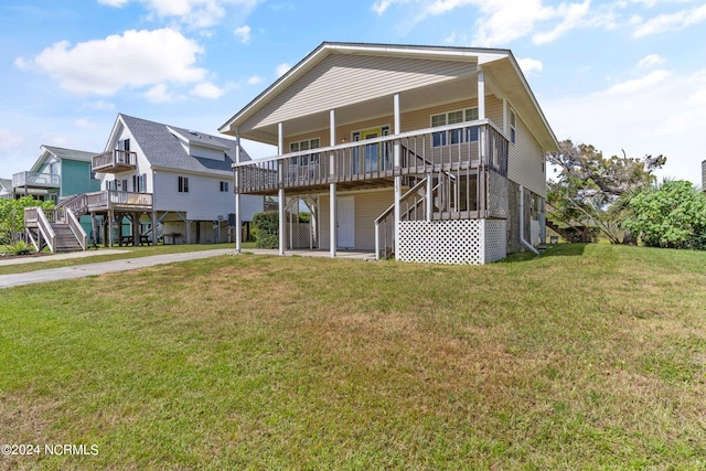 back of house featuring a yard and a deck