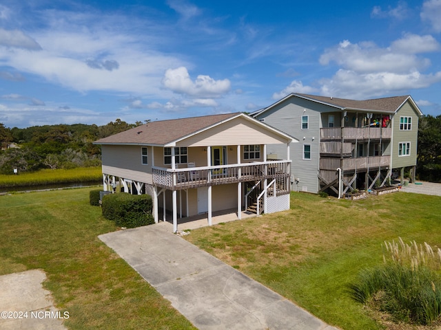 rear view of property with a lawn