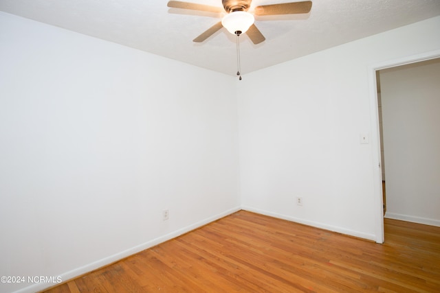 unfurnished room with ceiling fan and light hardwood / wood-style floors