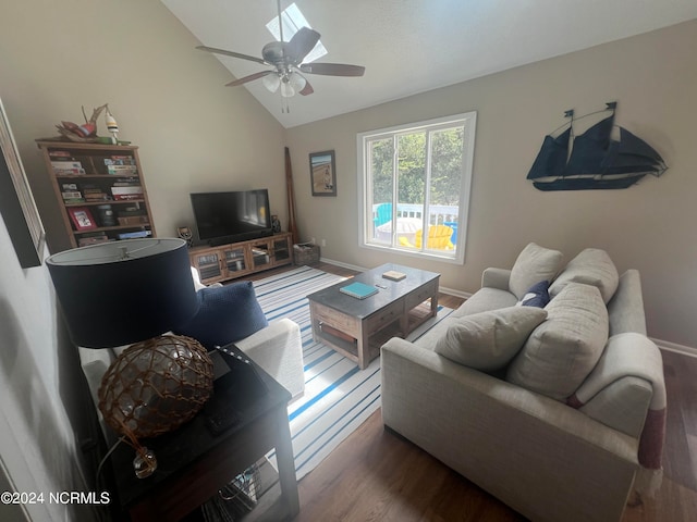 living room with lofted ceiling, ceiling fan, and dark wood-type flooring