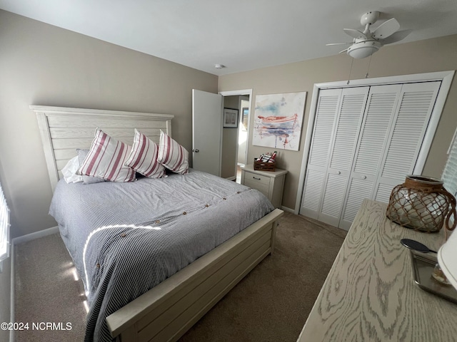 bedroom with dark colored carpet, ceiling fan, and a closet