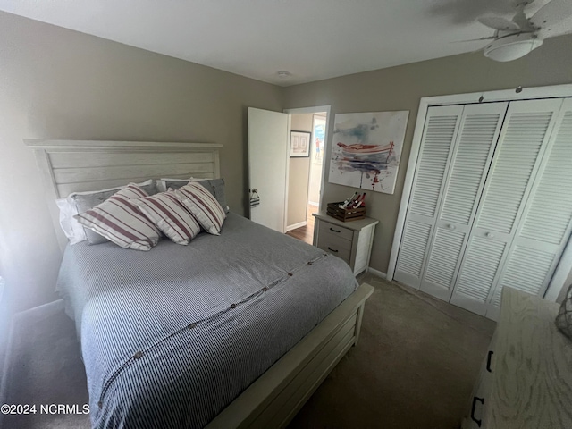 carpeted bedroom featuring ceiling fan and a closet