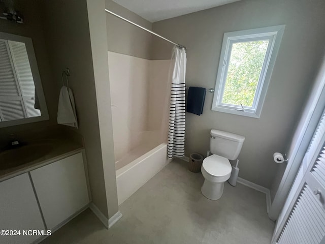 full bathroom with shower / tub combo with curtain, concrete flooring, vanity, and toilet