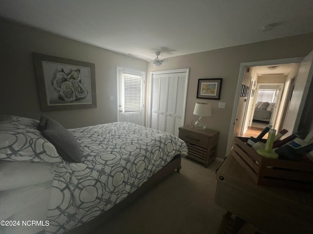 carpeted bedroom featuring a closet