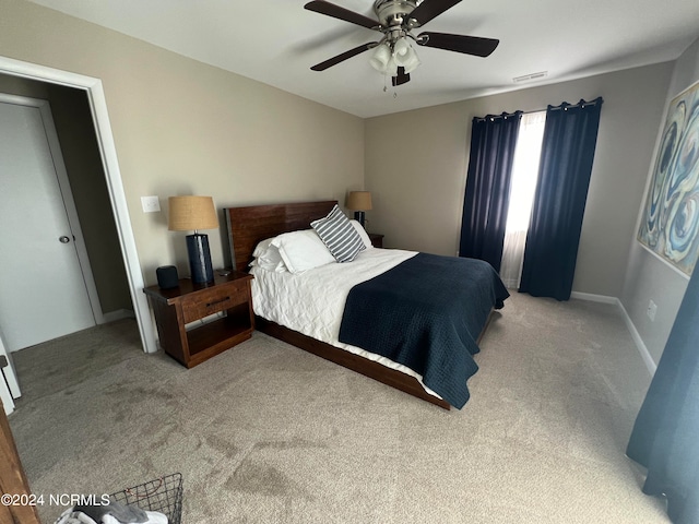 carpeted bedroom featuring ceiling fan