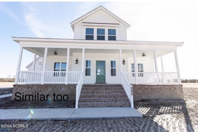 country-style home with covered porch