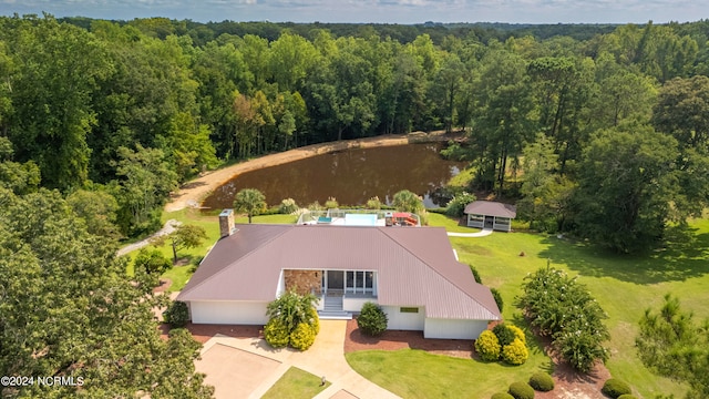 aerial view featuring a water view and a wooded view