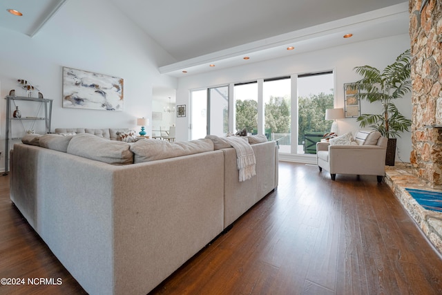 living area with dark wood-style floors and high vaulted ceiling