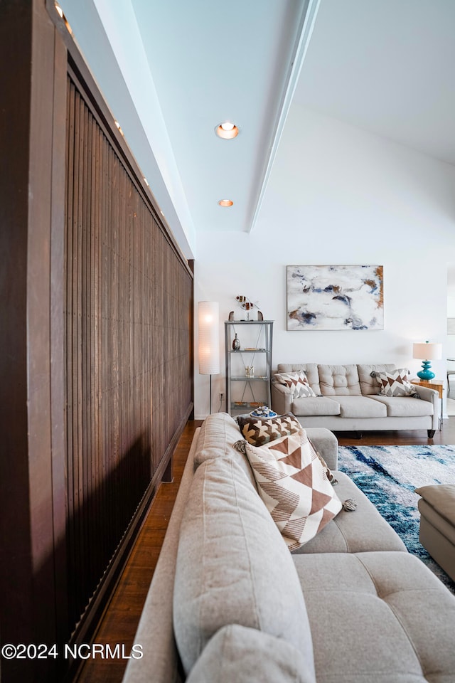 living room with lofted ceiling, dark wood finished floors, and recessed lighting