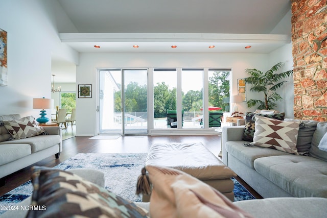 living room with an inviting chandelier and wood finished floors