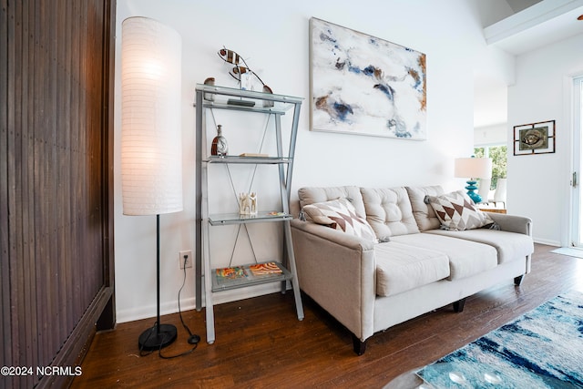 living room featuring baseboards and wood finished floors