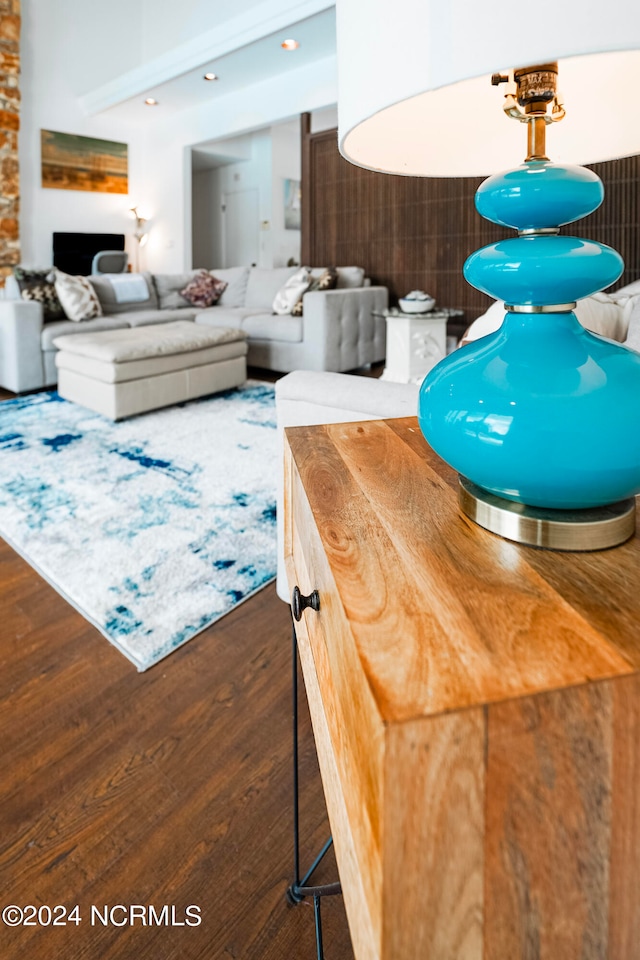 interior space featuring dark hardwood / wood-style floors, wood counters, and a breakfast bar area