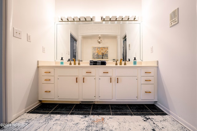 full bathroom with visible vents, a sink, baseboards, and double vanity