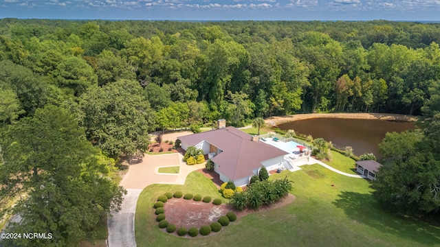 aerial view featuring a water view and a view of trees