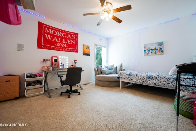 carpeted bedroom with ceiling fan