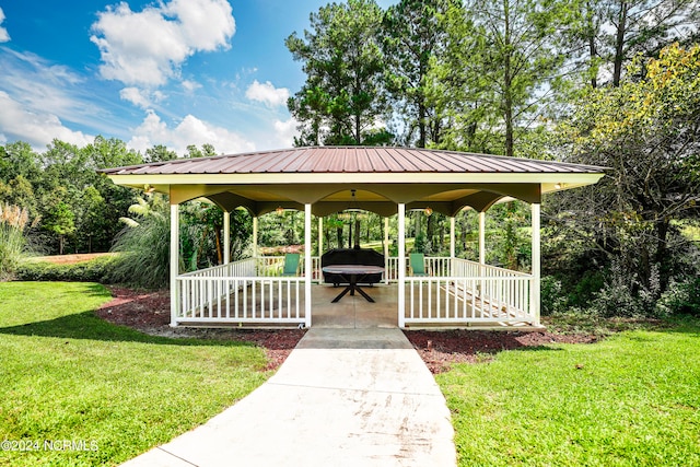 surrounding community featuring a gazebo and a lawn