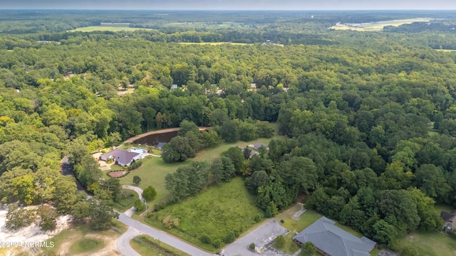 aerial view featuring a view of trees