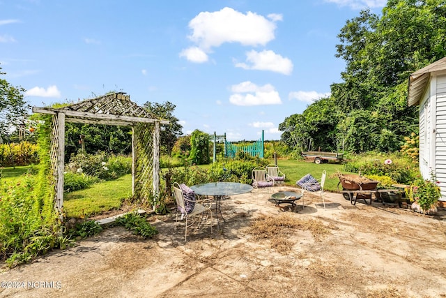 view of yard with a fire pit, a patio, and a gazebo