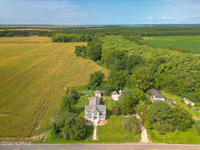 bird's eye view featuring a forest view and a rural view