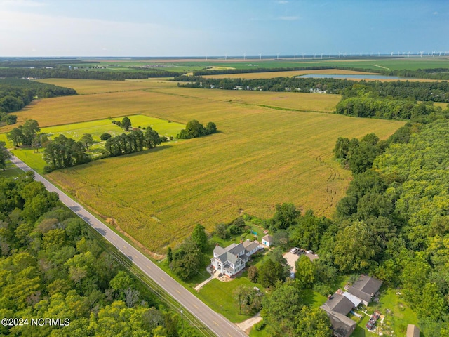 birds eye view of property featuring a water view and a rural view