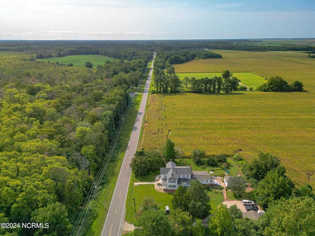 birds eye view of property with a rural view