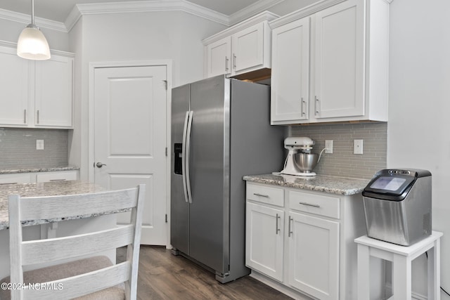 kitchen featuring dark wood-type flooring, hanging light fixtures, white cabinets, and stainless steel refrigerator with ice dispenser