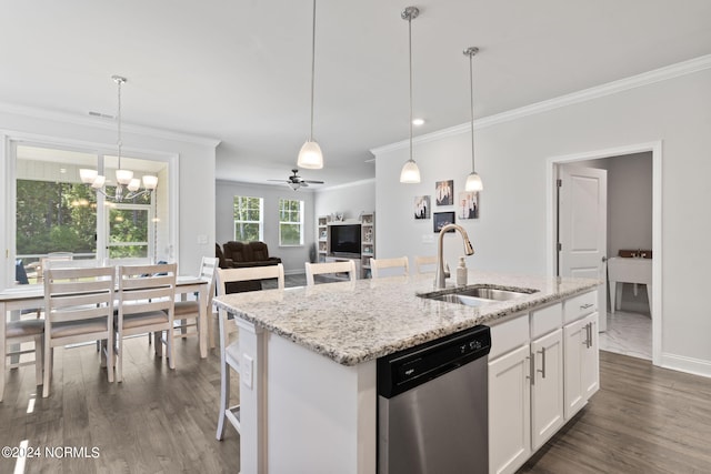 kitchen featuring ceiling fan with notable chandelier, dishwasher, a kitchen island with sink, sink, and white cabinetry