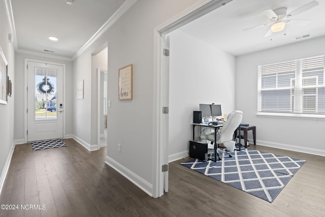 interior space with ceiling fan, dark hardwood / wood-style flooring, and ornamental molding