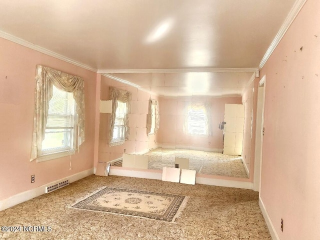 interior space featuring visible vents, crown molding, and baseboards