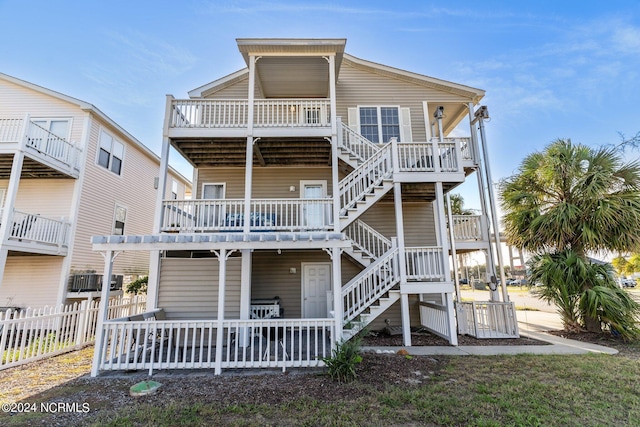 beach home with stairs and fence