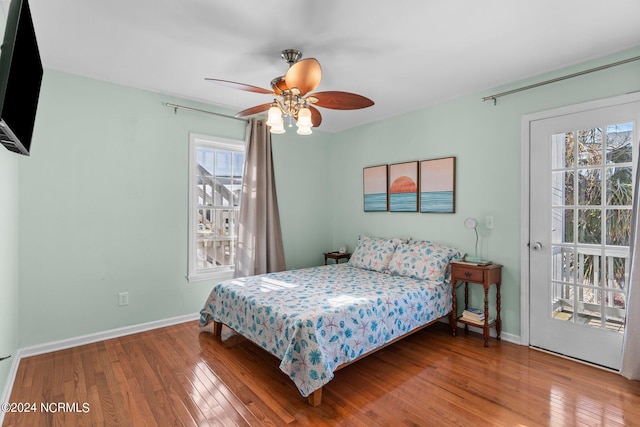 bedroom featuring ceiling fan, baseboards, and hardwood / wood-style floors