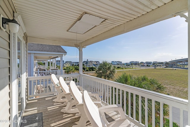 wooden terrace featuring a residential view